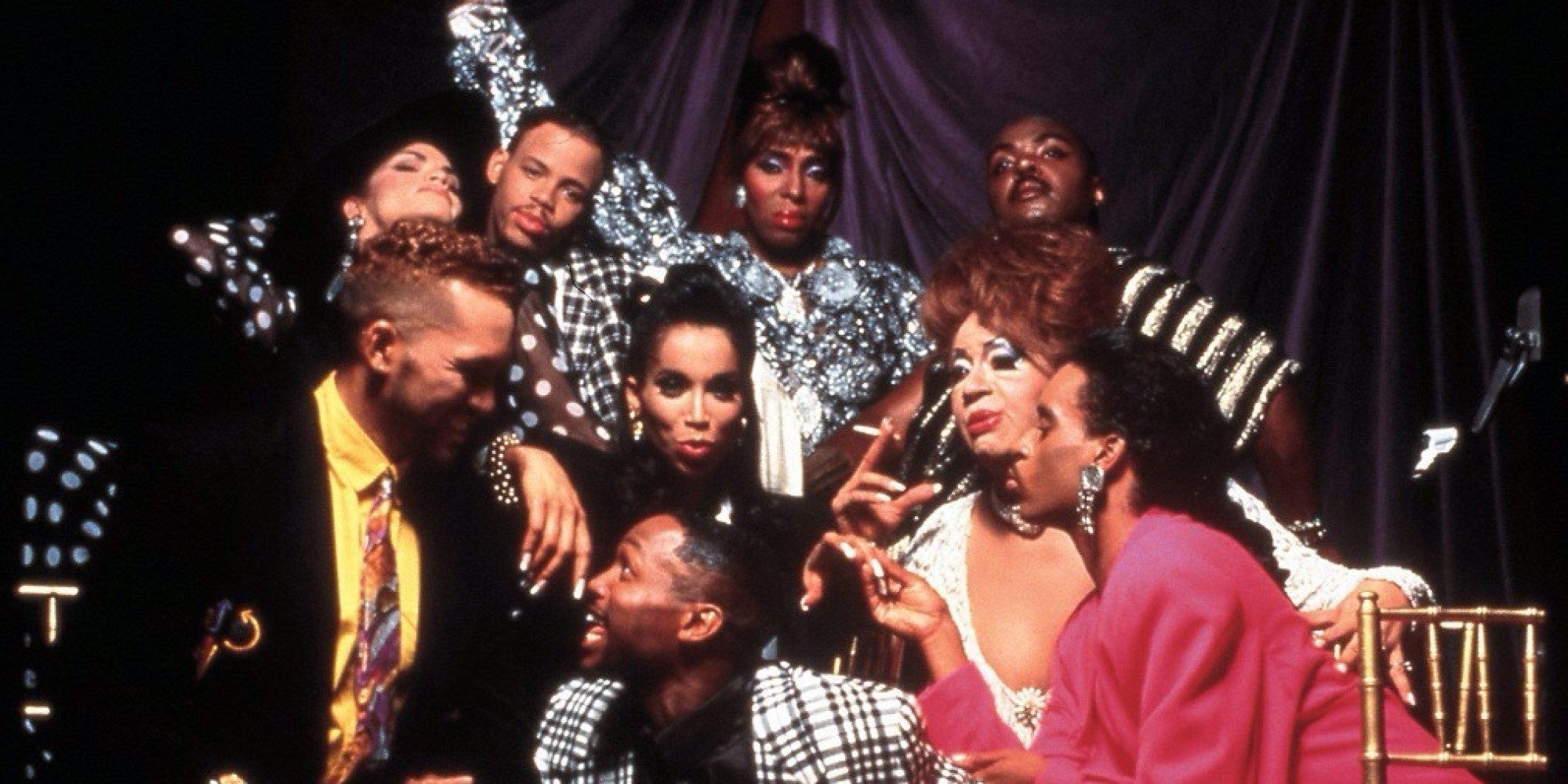 The cast of Paris is Burning celebrating together.